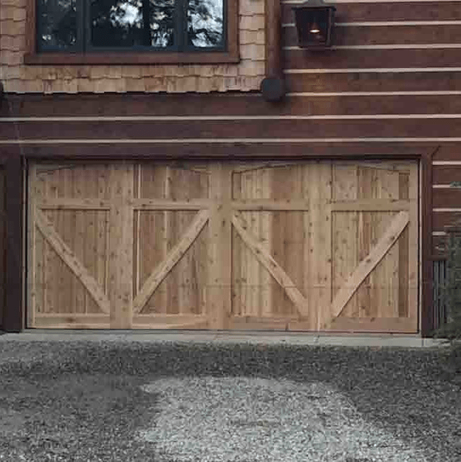 Custom wood garage door with an overlay